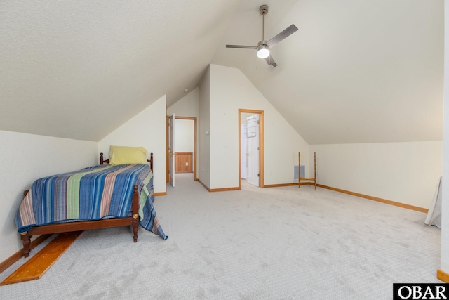 bedroom featuring carpet, vaulted ceiling, a ceiling fan, and baseboards