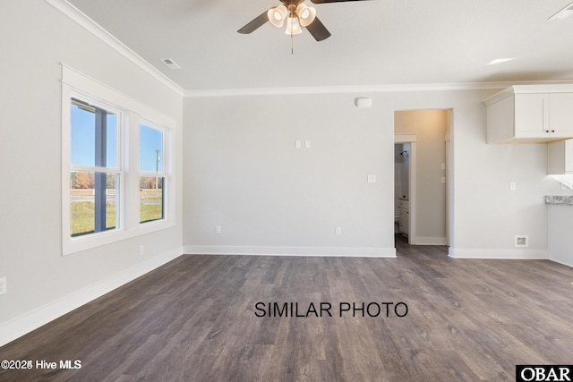 unfurnished living room with baseboards, visible vents, dark wood-style flooring, and crown molding