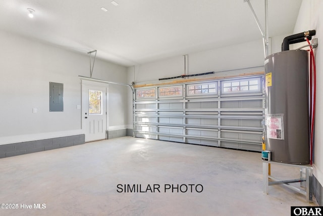 garage featuring electric panel and water heater