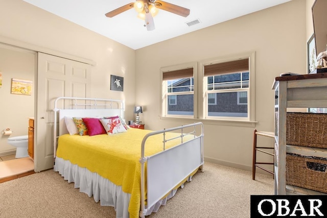 bedroom with a ceiling fan, light colored carpet, visible vents, and baseboards