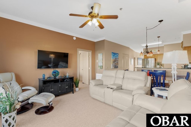 living room with light carpet, ceiling fan, and crown molding