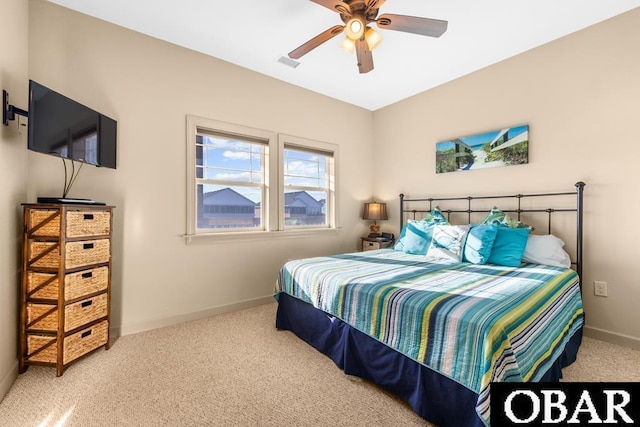 bedroom with visible vents, baseboards, ceiling fan, and carpet flooring