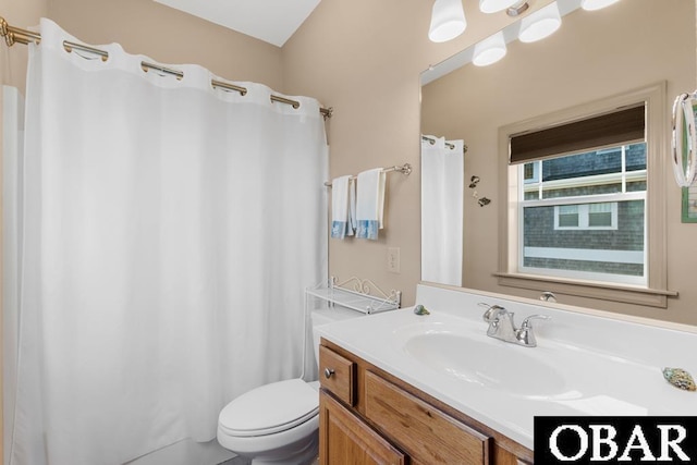 bathroom with toilet and vanity