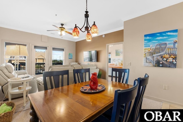 dining area with ceiling fan, ornamental molding, and baseboards