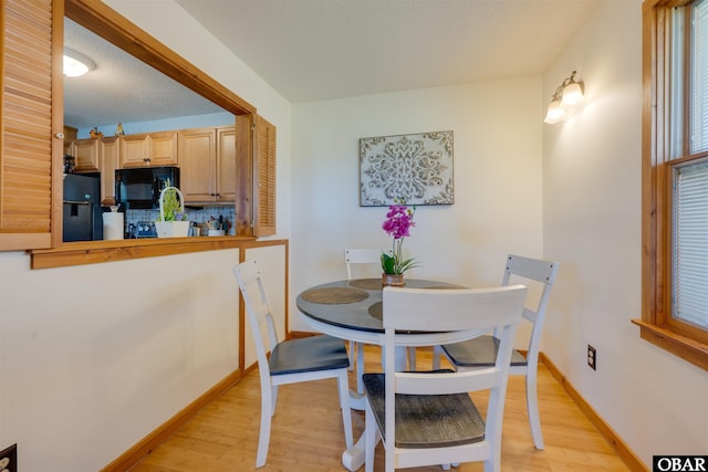 2009 Wrightsville Blvd Unit 4-B, Kill Devil Hills, NC 27948 - dining room featuring light wood finished floors and baseboards