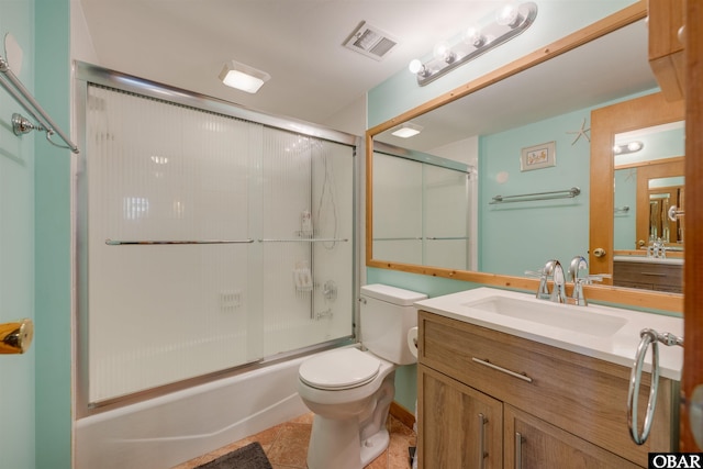 2009 Wrightsville Blvd Unit 4-B, Kill Devil Hills, NC 27948 - bathroom with vanity, toilet, and shower / bath combination with glass door