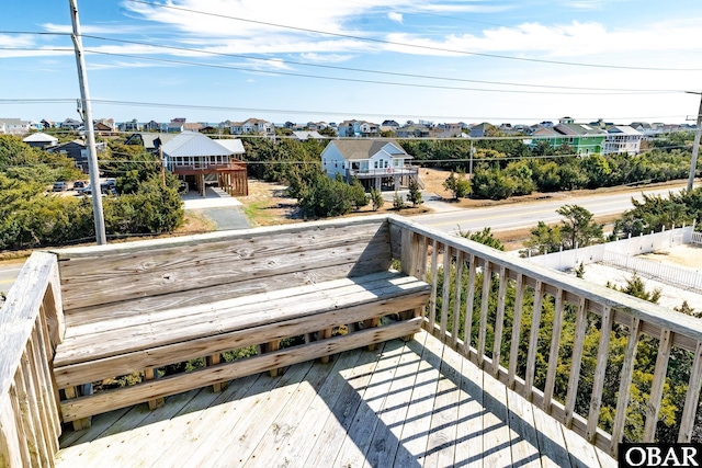 wooden deck with a residential view