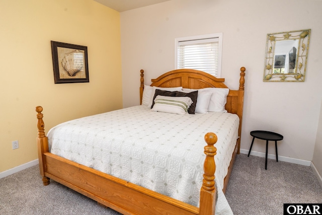 bedroom with carpet and baseboards