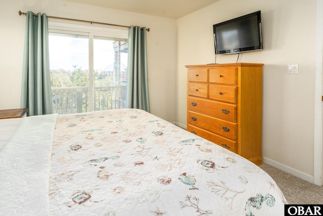 carpeted bedroom with baseboards