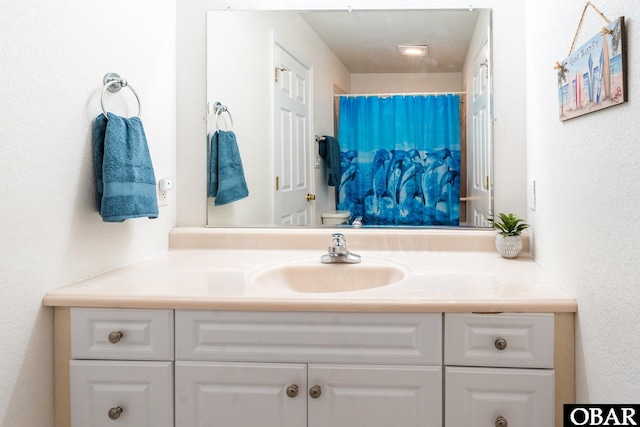 full bathroom with vanity and toilet