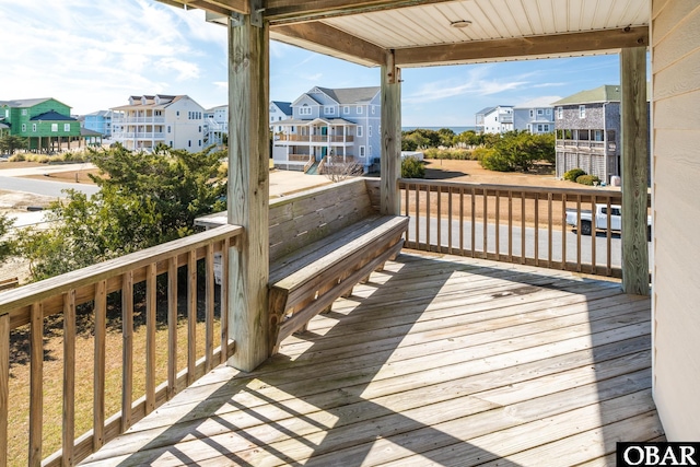 wooden terrace with a residential view