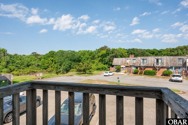 3002 Seahorse Ct Unit 3002, Kitty Hawk, NC 27949 - balcony featuring a forest view