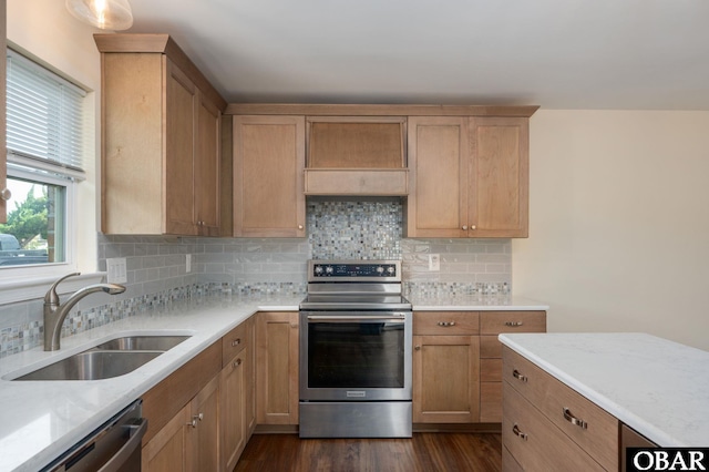 3002 Seahorse Ct Unit 3002, Kitty Hawk, NC 27949 - kitchen with appliances with stainless steel finishes, a sink, decorative backsplash, and dark wood finished floors