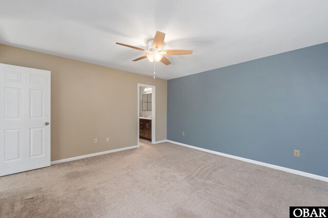 3002 Seahorse Ct Unit 3002, Kitty Hawk, NC 27949 - unfurnished bedroom featuring carpet flooring, baseboards, ensuite bathroom, and a ceiling fan