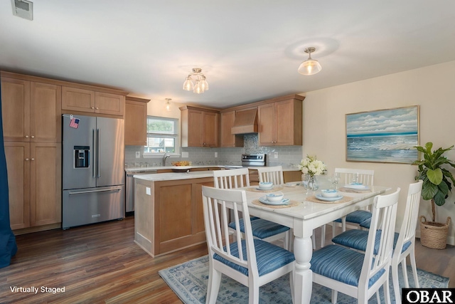 3002 Seahorse Ct Unit 3002, Kitty Hawk, NC 27949 - kitchen featuring stainless steel appliances, custom exhaust hood, light countertops, and dark wood finished floors