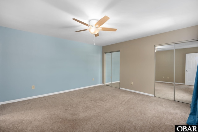 3002 Seahorse Ct Unit 3002, Kitty Hawk, NC 27949 - unfurnished bedroom featuring two closets, carpet floors, baseboards, and ceiling fan