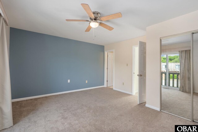3002 Seahorse Ct Unit 3002, Kitty Hawk, NC 27949 - unfurnished bedroom featuring carpet, a closet, baseboards, and ceiling fan