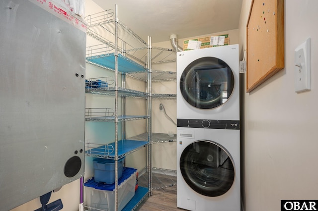 3002 Seahorse Ct Unit 3002, Kitty Hawk, NC 27949 - laundry area with stacked washer / dryer and wood finished floors