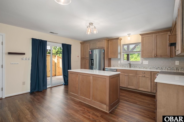 3002 Seahorse Ct Unit 3002, Kitty Hawk, NC 27949 - kitchen featuring high end fridge, a sink, a kitchen island, decorative backsplash, and dark wood-style flooring