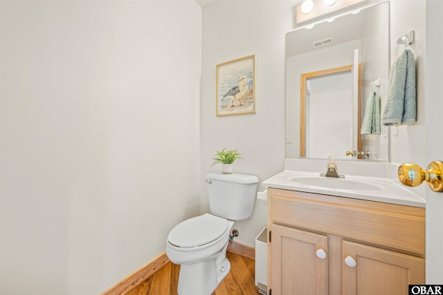 903 Windward Way Lot 15, Corolla, NC 27927 - bathroom with baseboards, wood finished floors, vanity, and toilet