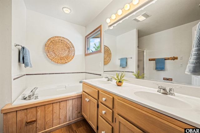 903 Windward Way Lot 15, Corolla, NC 27927 - full bathroom featuring wood finished floors, a shower stall, a bath, and double vanity