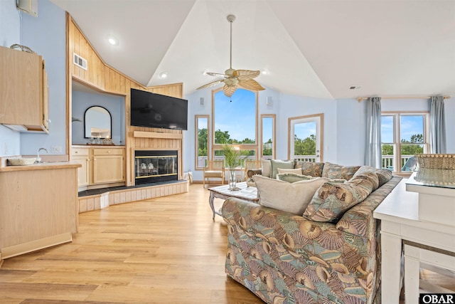 903 Windward Way Lot 15, Corolla, NC 27927 - living room featuring ceiling fan, lofted ceiling, a fireplace, and light wood finished floors