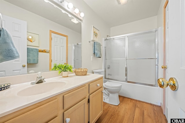 903 Windward Way Lot 15, Corolla, NC 27927 - full bath with toilet, wood finished floors, vanity, and enclosed tub / shower combo
