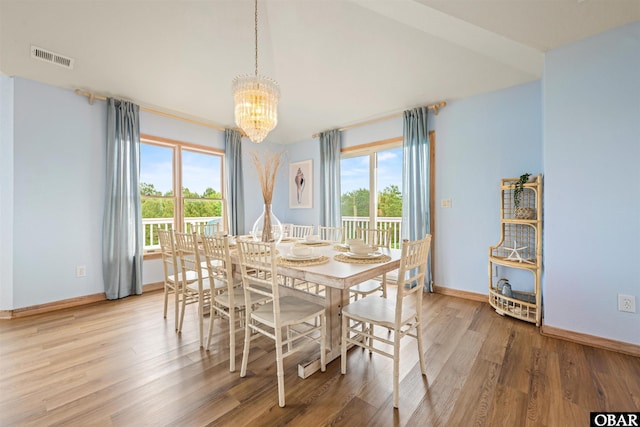 903 Windward Way Lot 15, Corolla, NC 27927 - dining space featuring plenty of natural light, a chandelier, light wood-style flooring, and baseboards