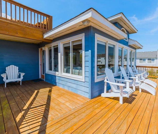 wooden terrace with a sunroom