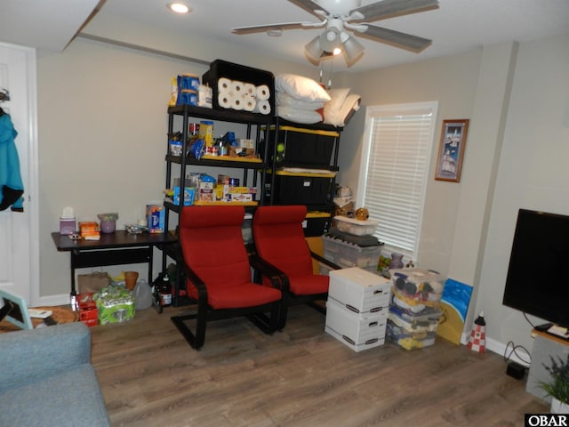 office space with baseboards, a ceiling fan, wood finished floors, and recessed lighting