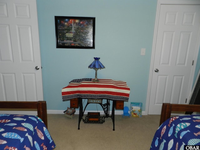 bedroom with carpet and baseboards