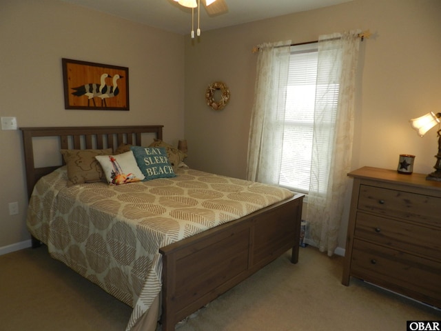 carpeted bedroom featuring baseboards