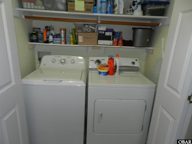 washroom featuring laundry area and separate washer and dryer