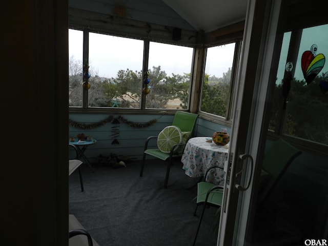 sunroom / solarium with lofted ceiling