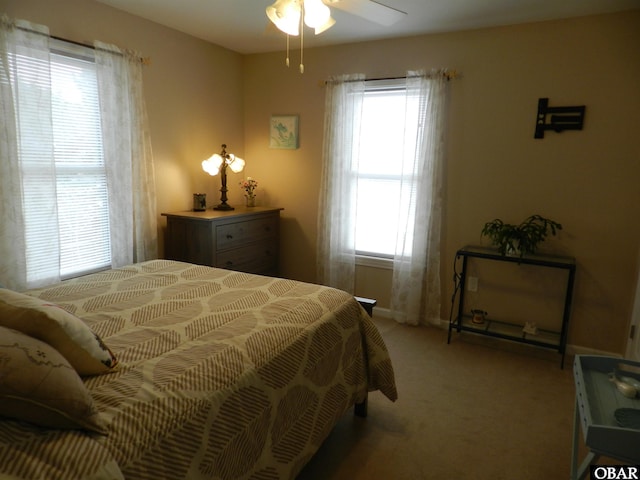 bedroom featuring light carpet