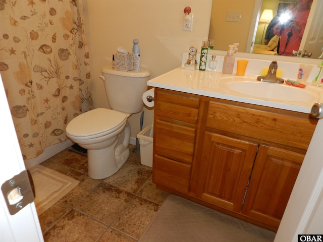 full bathroom featuring vanity and toilet