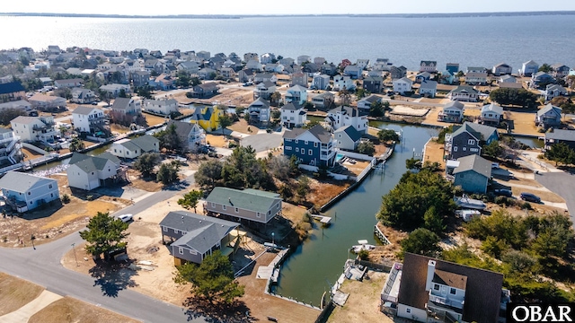 aerial view featuring a water view and a residential view