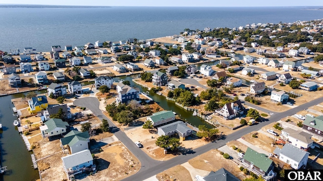 aerial view featuring a water view and a residential view