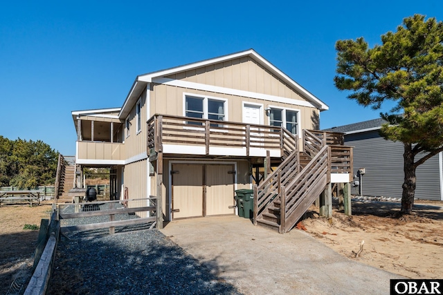 view of front of house featuring stairway and a deck