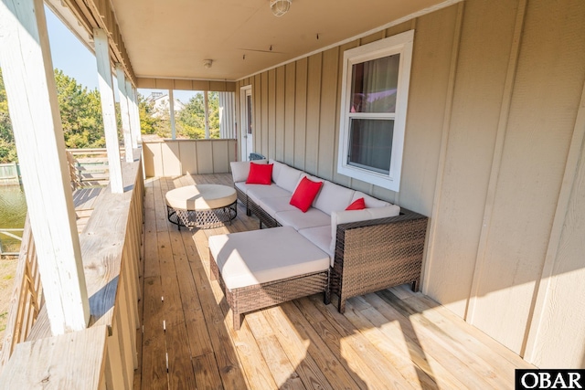 wooden deck with an outdoor hangout area