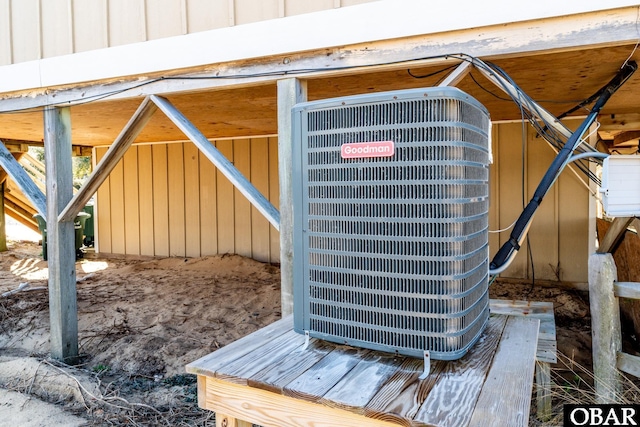 exterior details with board and batten siding and central air condition unit