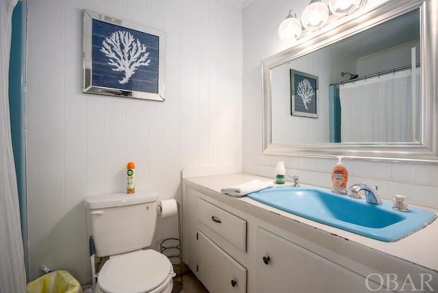 full bathroom featuring vanity and toilet