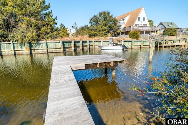 dock area with a water view