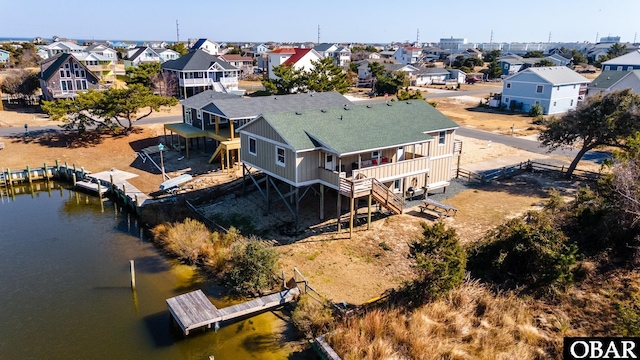 aerial view with a residential view and a water view