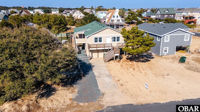 view of front of home featuring driveway and a residential view