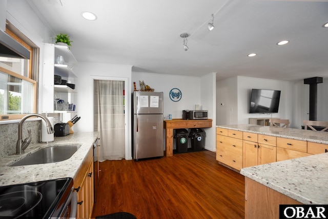 kitchen with light stone counters, light brown cabinets, appliances with stainless steel finishes, dark wood-style floors, and open shelves