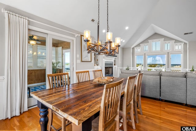 4311 S Hesperides Dr Lot # 55, Nags Head, NC 27959 - dining area featuring light wood-style floors, a wealth of natural light, vaulted ceiling, and visible vents