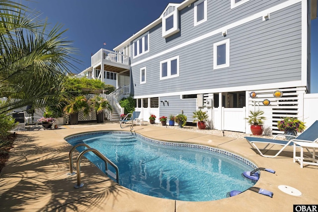 4311 S Hesperides Dr Lot # 55, Nags Head, NC 27959 - view of swimming pool featuring fence, a fenced in pool, a patio area, and stairway
