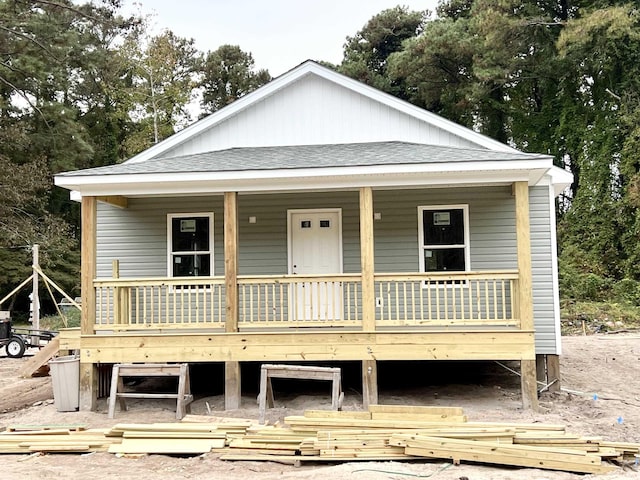 view of front of home with a shingled roof