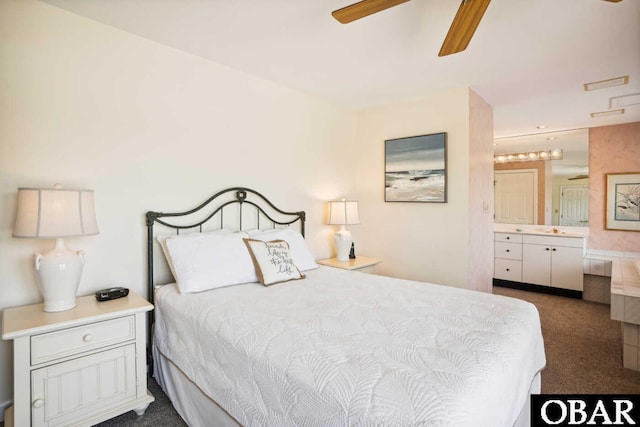 bedroom with carpet, ceiling fan, and connected bathroom